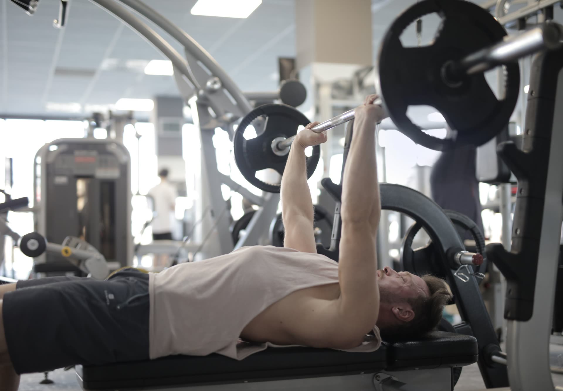 Athlete training with a barbell in a gym